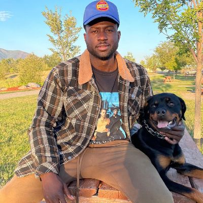 Photo of Sinqua Walls and his dog, Yung Nino.